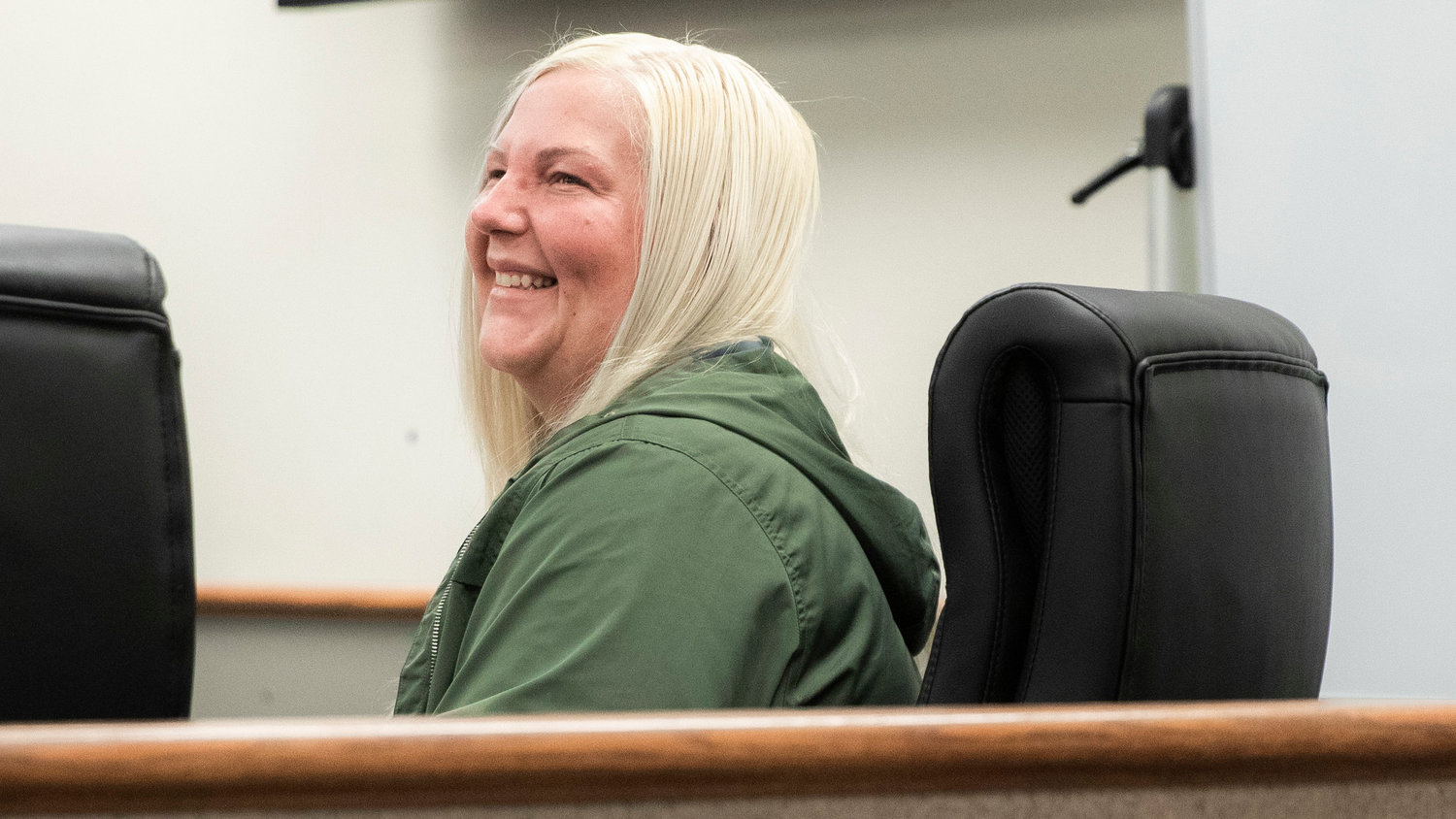 Charlotte Sharon Norton smiles before receiving a medallion for successfully completing the Mental Health Court Program on Thursday in Lewis County Superior Court.