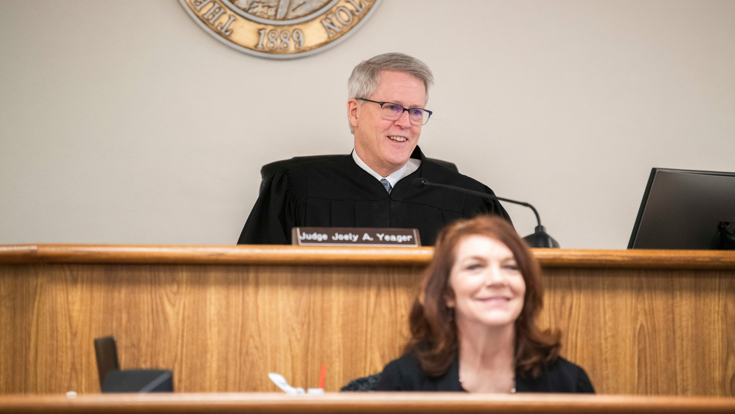 Judge James W. Lawler smiles while congratulating Charlotte Sharon Norton on successfully completing the Mental Health Court Program on Thursday in Lewis County Superior Court.
