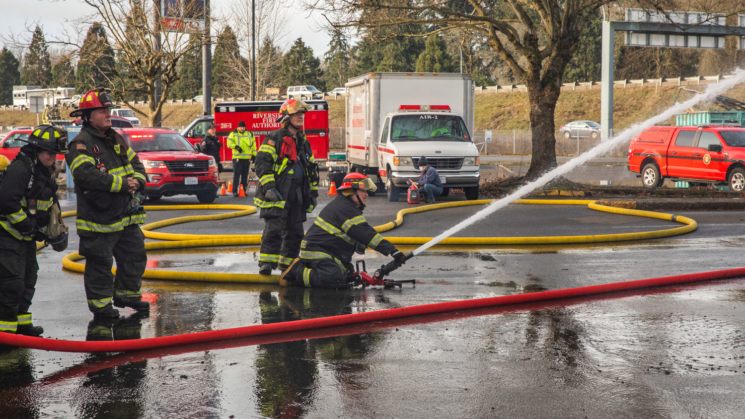 Crews from Riverside Fire Authority work to put out flames inside the former location of Papa Pete’s and Shari’s Cafe in Centralia on Sunday.