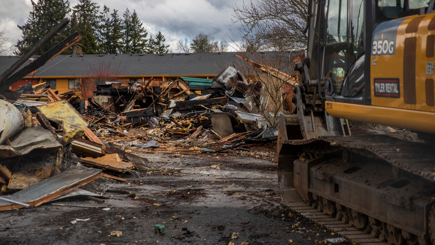 Charred debris remains at the former location of Papa Pete’s and Shari’s Cafe in Centralia on Tuesday after a fire consumed the structure.