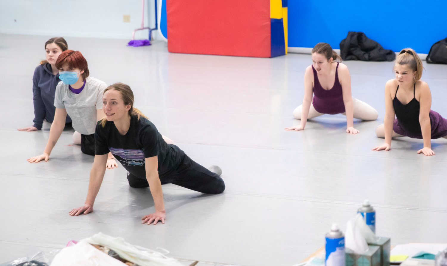 Briana Jones, an instructor at the Southwest Washington Dance Center in Chehalis, stretches with students while preparing for upcoming performances during a class on Thursday.