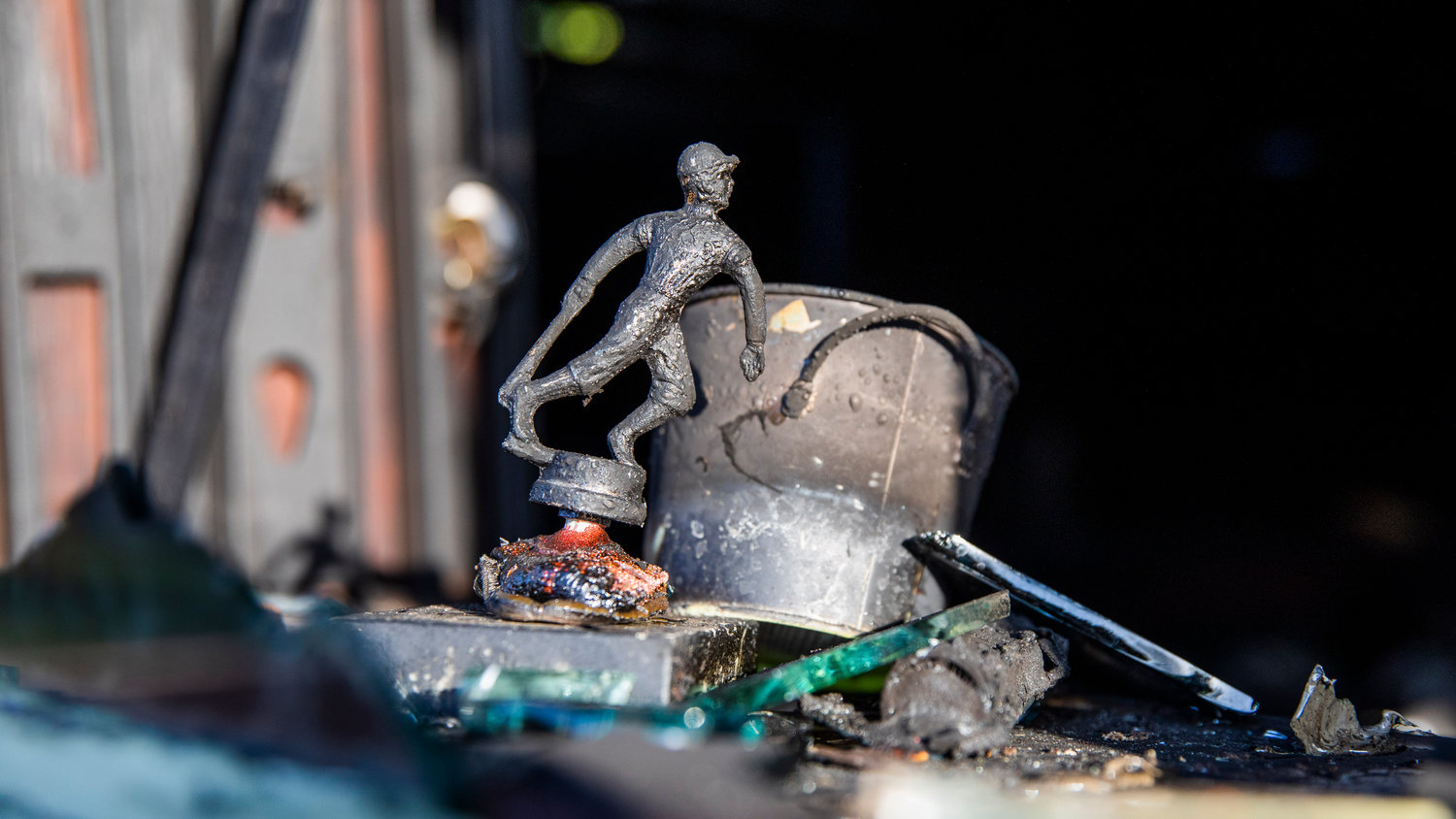 Melted trophies are seen at a structure fire along View Avenue in Centralia where a detached garage and items inside were damaged by flames Wednesday morning.