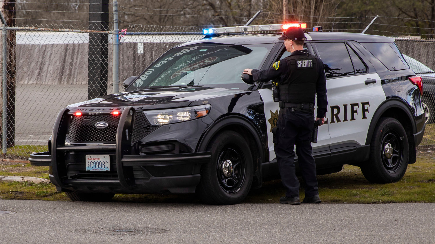 Thurston County Sheriff's Office deputies create a perimeter around the area of 201st Avenue Southwest in Grand Mound on Wednesday.