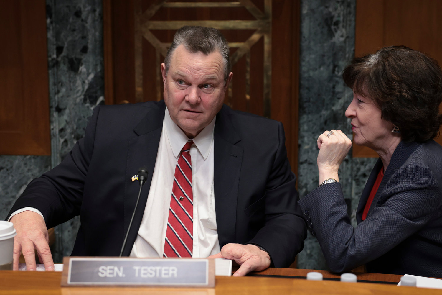 Committee Chairman Sen. Jon Tester (D-Montana), left, confers with Sen. Susan Collins (R-Maine) after a panel testified before the Senate Appropriations Subcommittee on Defense on China's high altitude balloon surveillance efforts against the United States Feb. 9, 2023, in Washington, D.C. (Win McNamee/Getty Images/TNS)