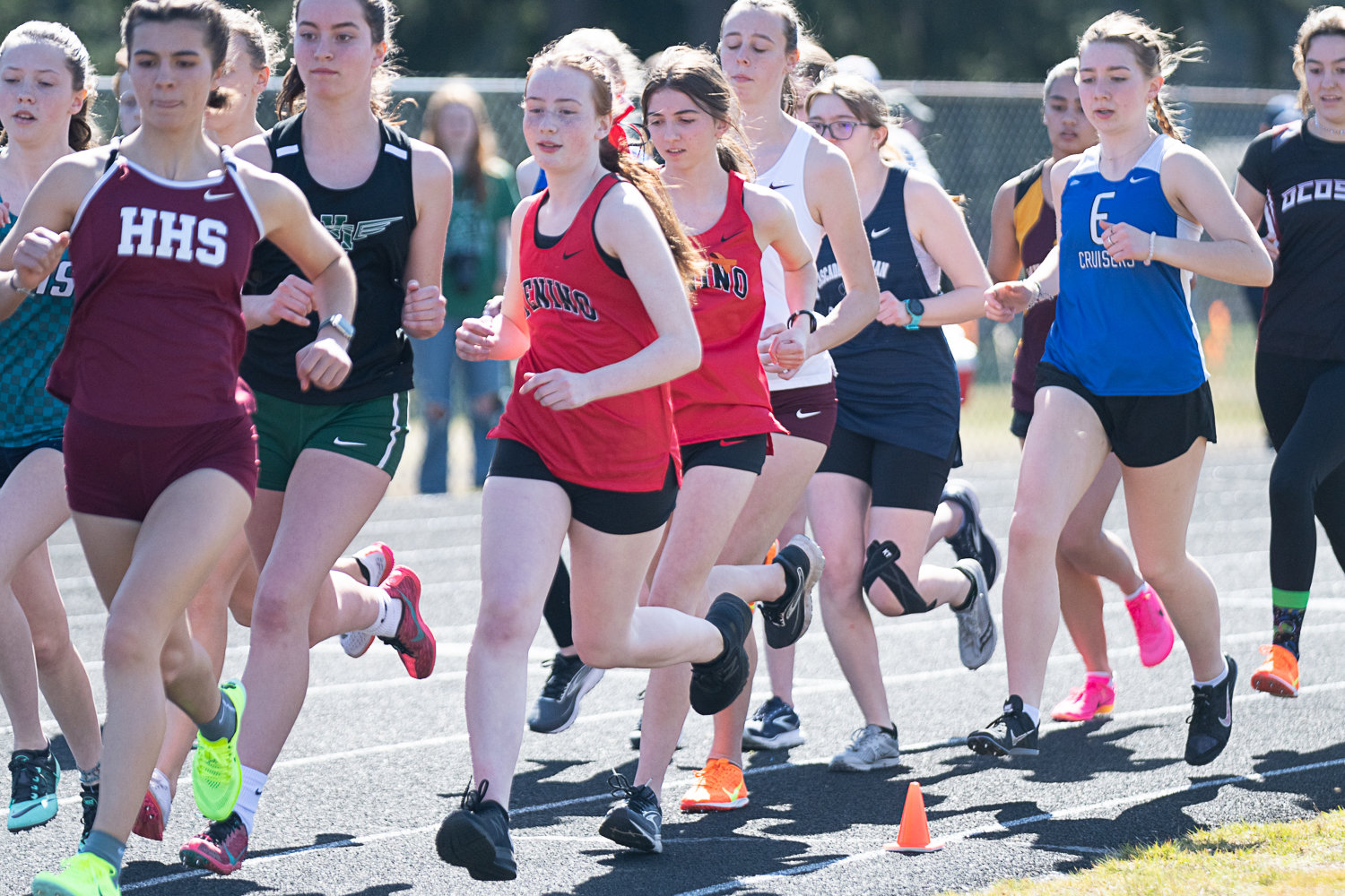 Tenino's Brynn Williams and Haley Huber find themselves in the middle of the pack in a heat of the girls 1,600-meter run at the Rainier Icebreaker on March 18.