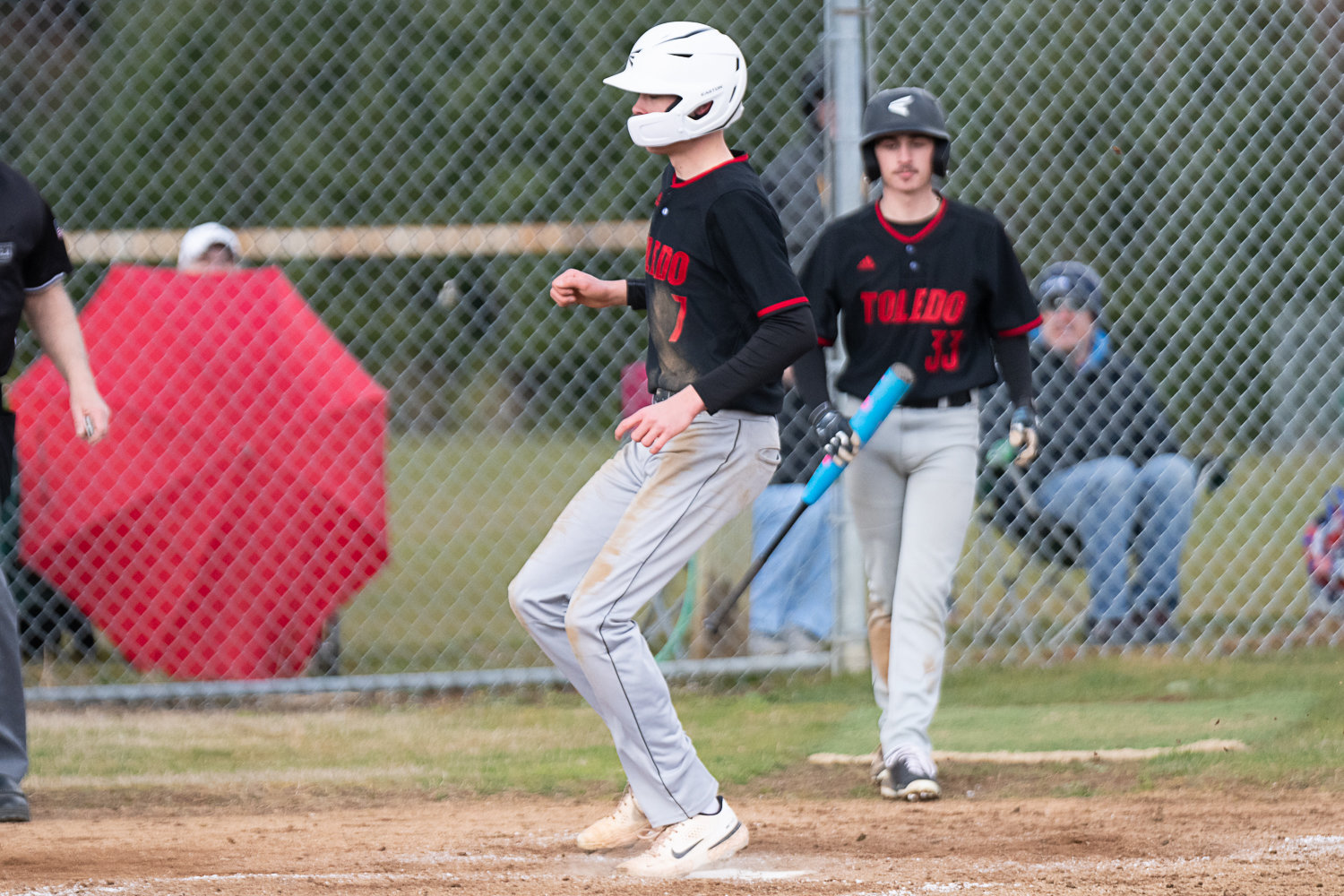 Rogan Stanley scores on a ball to the backstop during Toledo's 4-1 win over Napavine in Game 1 of a doubleheader on March 20.