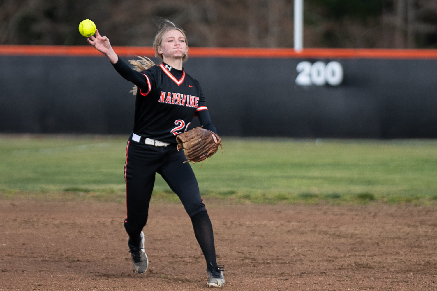 Taylen Evander throws to first during Napavine's game against Elma on March 20.
