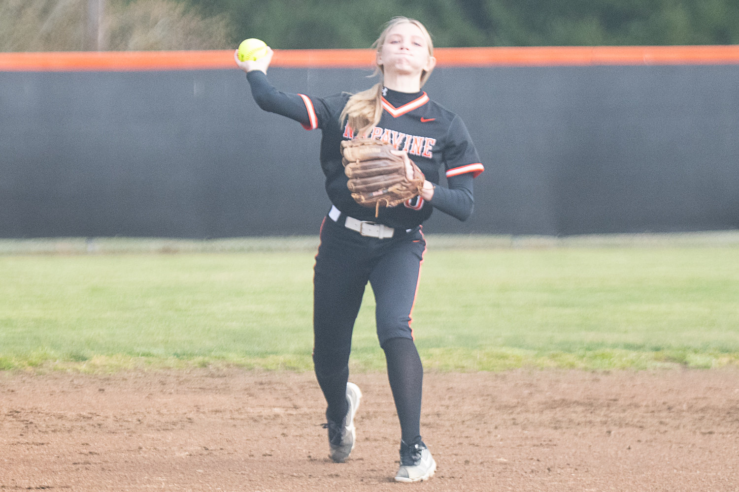 Taylen Evander relays a ball to the plate during Napavine's game against Elma on March 20.