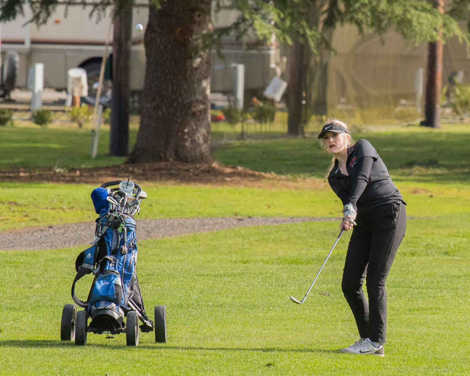 W.F. West senior Joy Stafford launches a ball from the fairway at Riverside Golf Course in Chehalis on Monday.