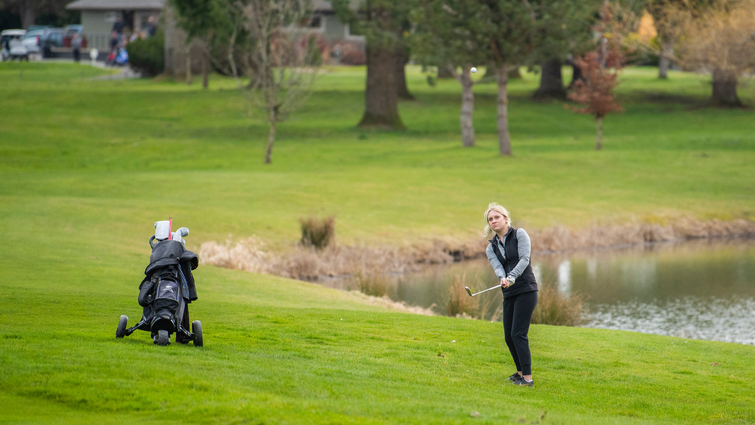 W.F. West senior Kendall Rasmussen hits a ball up at Riverside Golf Course in Chehlis Monday afternoon.