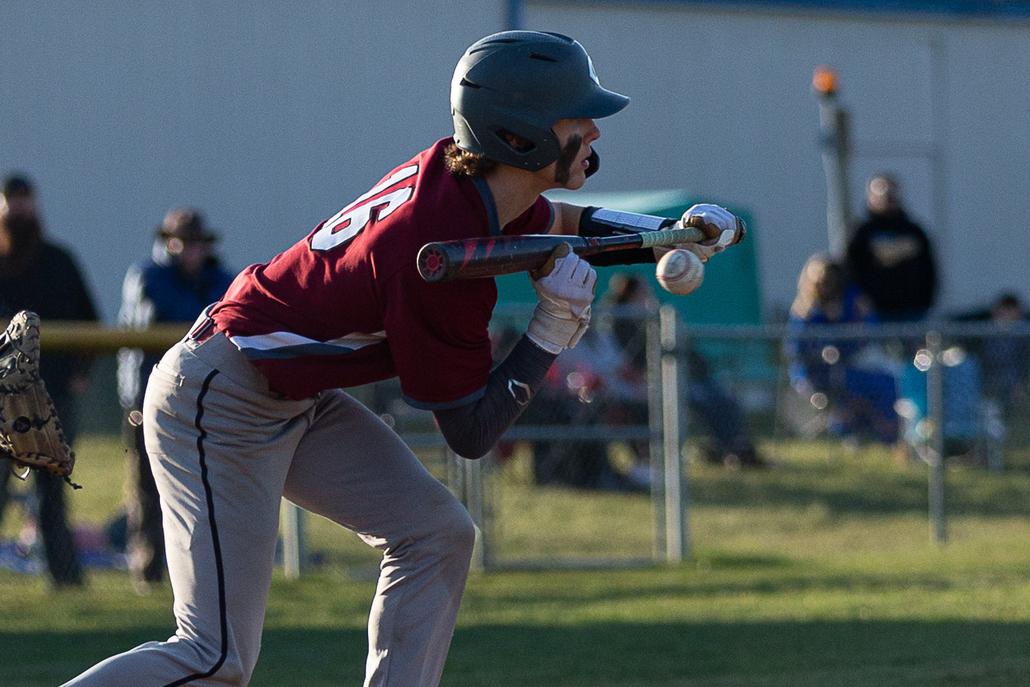W.F. West catcher Deacon Meller takes a pitch, holding back a bunt, against Rochester at Heinz-Rotter Field March 21.