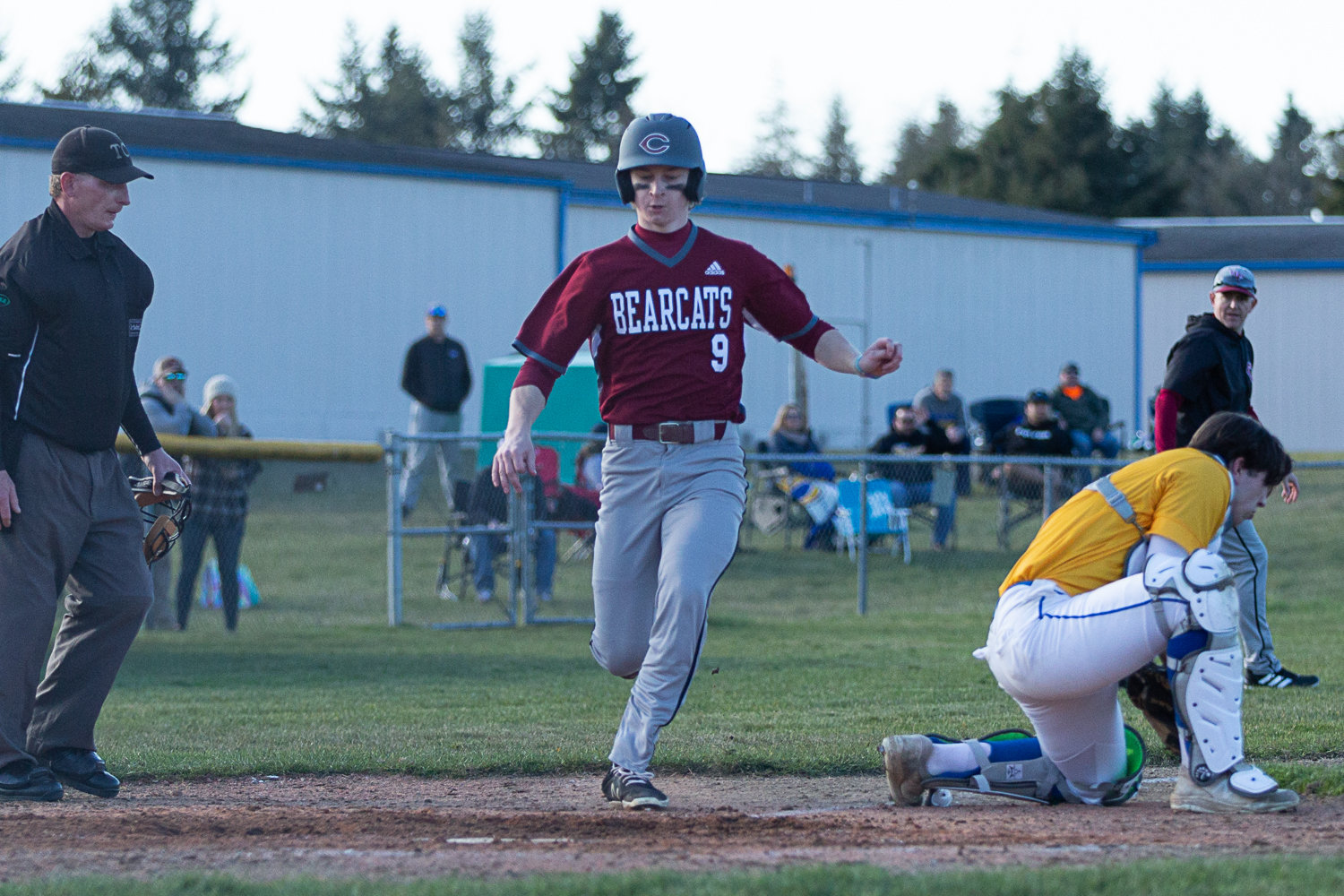 W.F. West's Avery Staloch runs across home plate against Rochester at Heinz-Rotter Field March 21.
