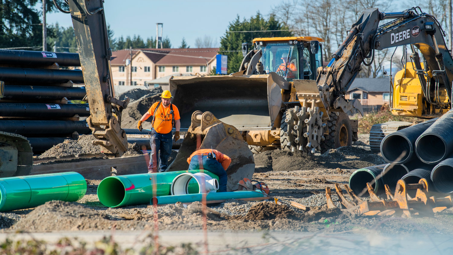 Crews work at the site of the Centralia Station project near Long Road in Centralia on Tuesday.