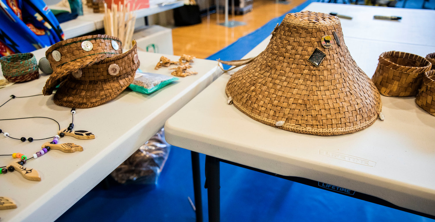 Weaved hats and baskets sit on display alongside jewelry during a ceremony honoring the Hazel Pete legacy at the Chehalis Tribe Community Center in Oakville on Saturday.