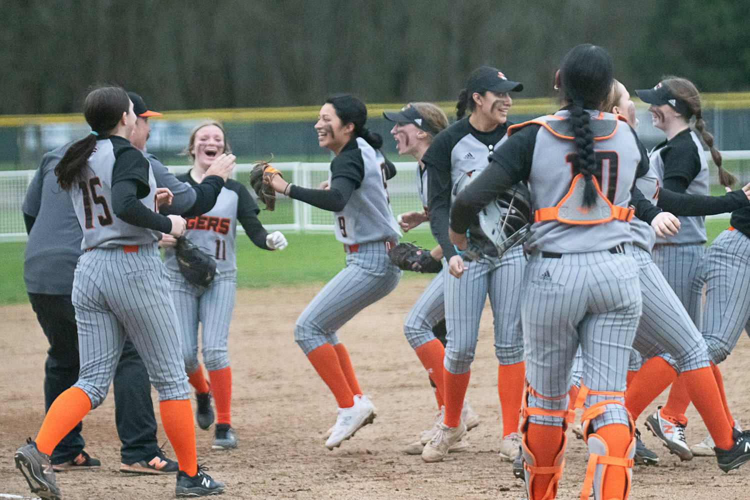 The Centralia softball team celebrates after the final out of its 5-3 win over W.F. West on March 28.