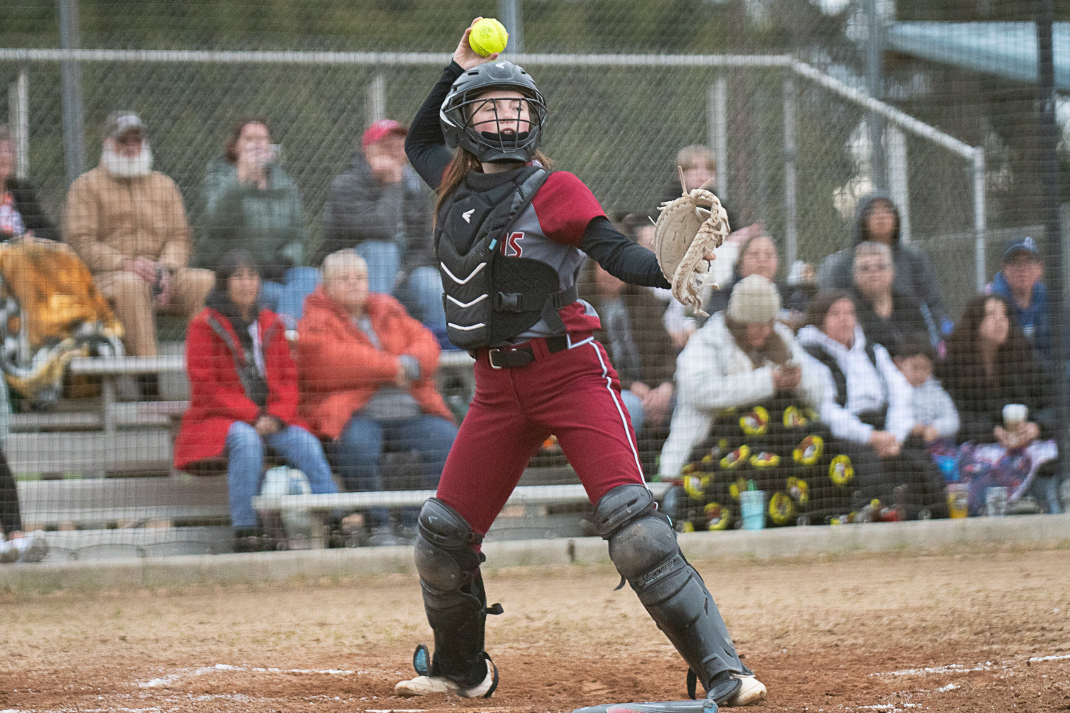 Rachel Gray makes a throw down to first base during W.F. West's 5-3 loss to Centralia on March 28.