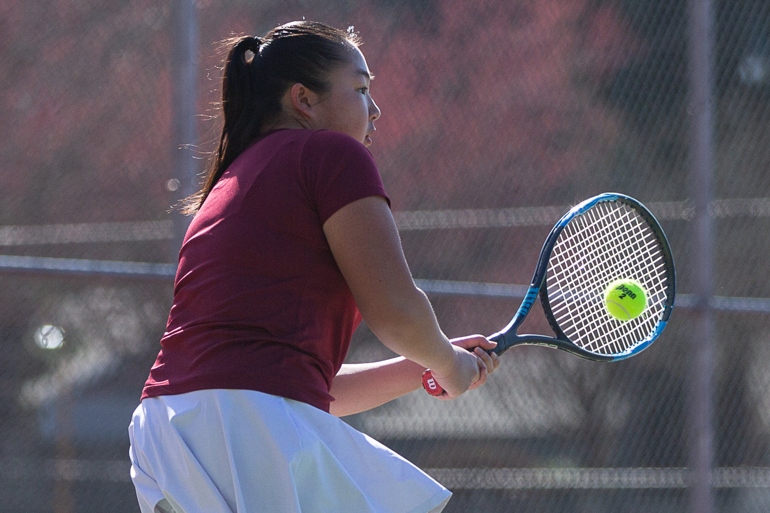 W.F. West singles player Laura Yip returns a volley against Tumwater March 29.