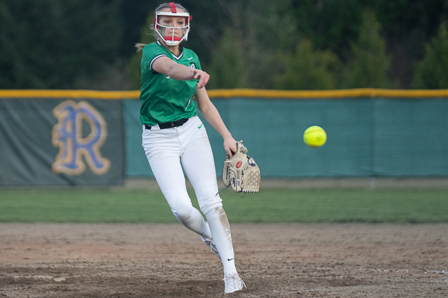 Ella Ferguson zips a pitch homeward during Tumwater's 5-3 win at Rochester on March 29.