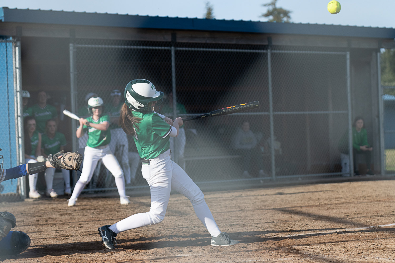 Chloe Foos pops a bloop in for an RBI single to put Tumwater ahead in its 5-3 win over Rochester on March 29.