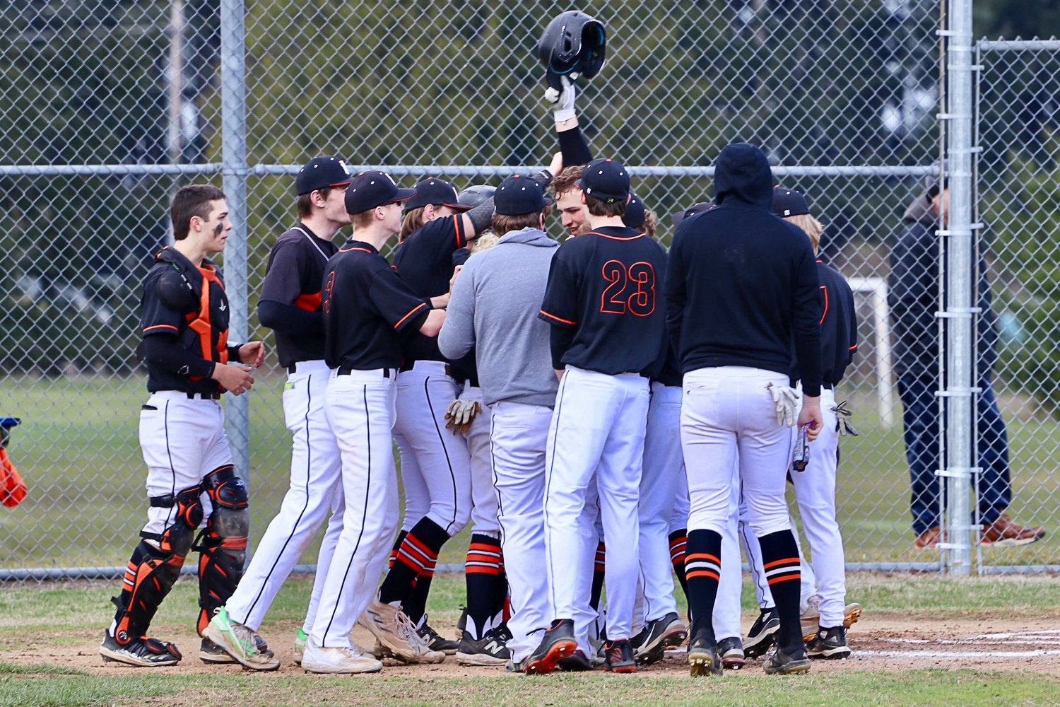 Napavine's Jack Nelson is mobbed at the plate after a home run against Wahkiakum March 30.