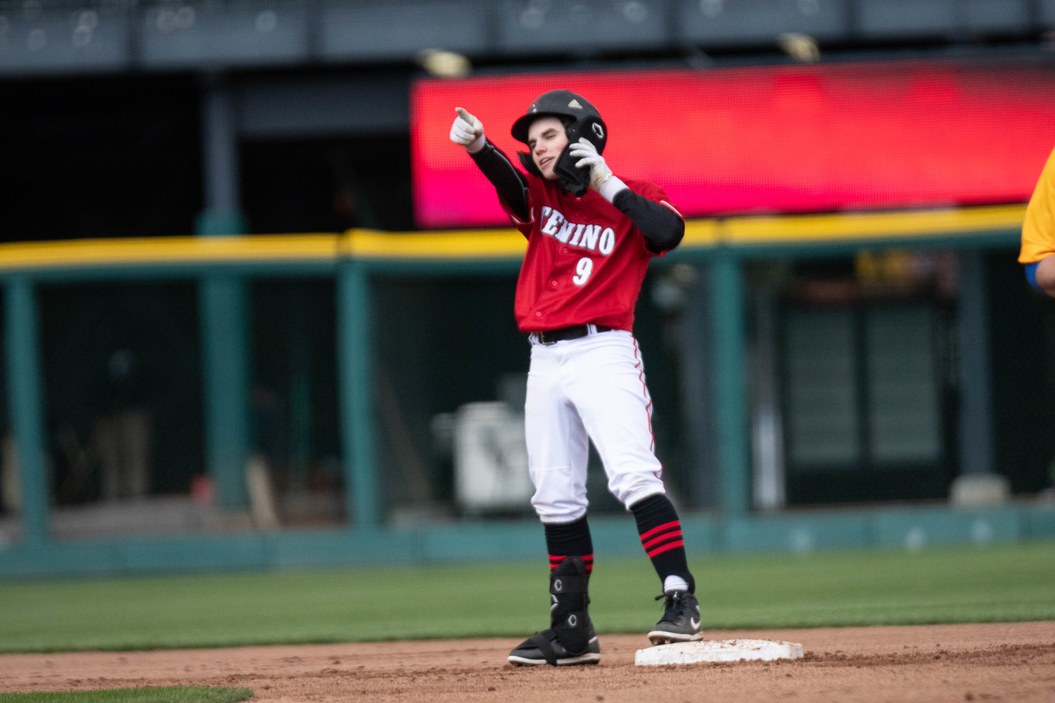 Will Feltus puts in a call from second after hitting a double in the first inning of Tenino's 11-7 loss to Rochester at Cheney Stadium in Tacoma on April 1.