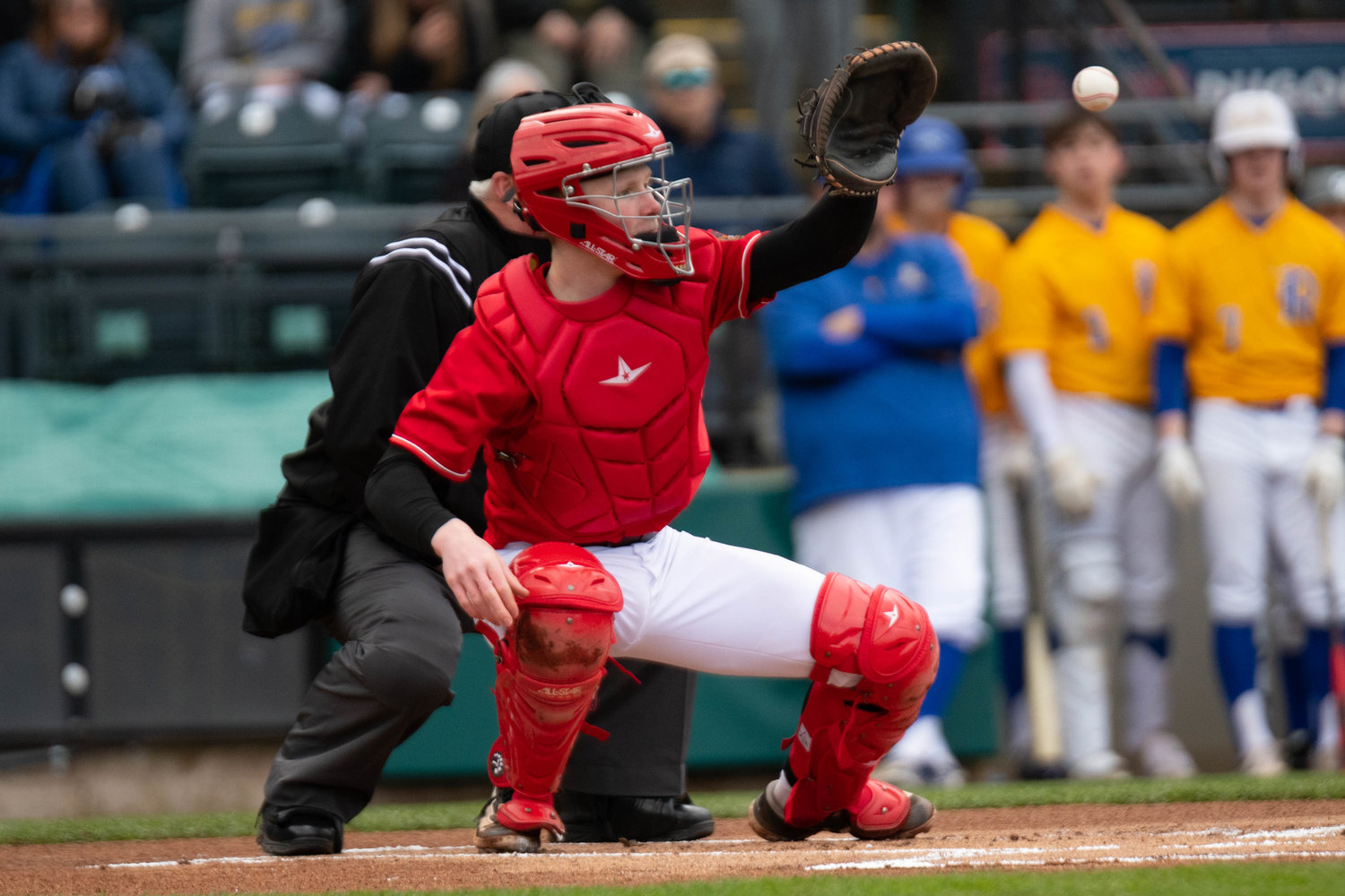 Austin Gonia catches the first pitch of the game in Tenino's 11-7 loss to Rochester, April 1 at Cheney Stadium.