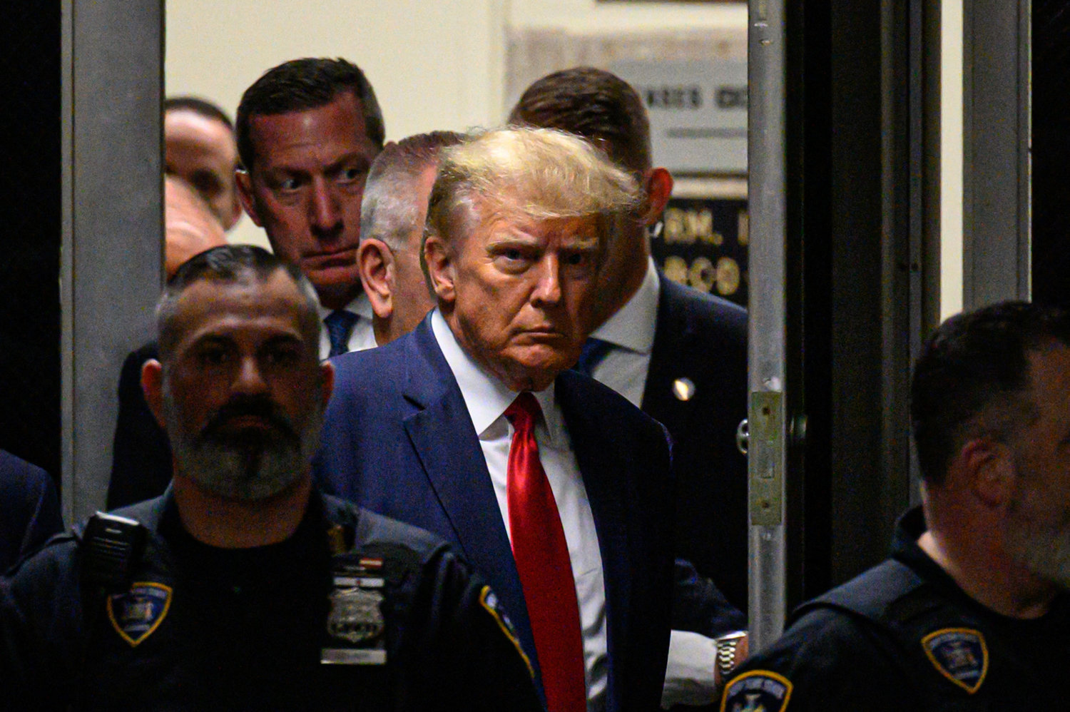 Former U.S. President Donald Trump makes his way inside the Manhattan Criminal Courthouse in New York on Tuesday, April 4, 2023.