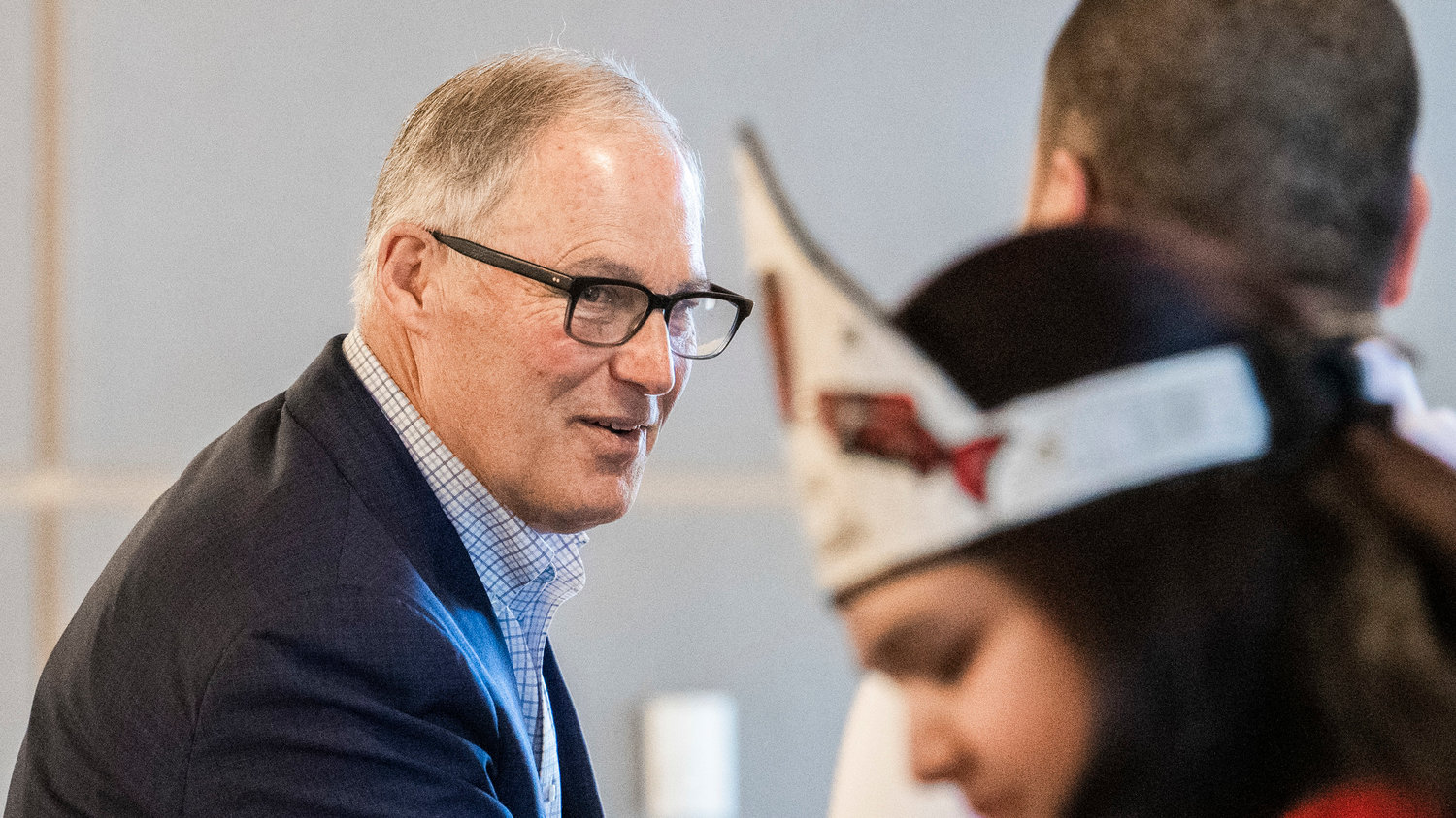 Governor Jay Inslee smiles and shakes hands during a meeting at the Chehalis Tribe Community Center in March.