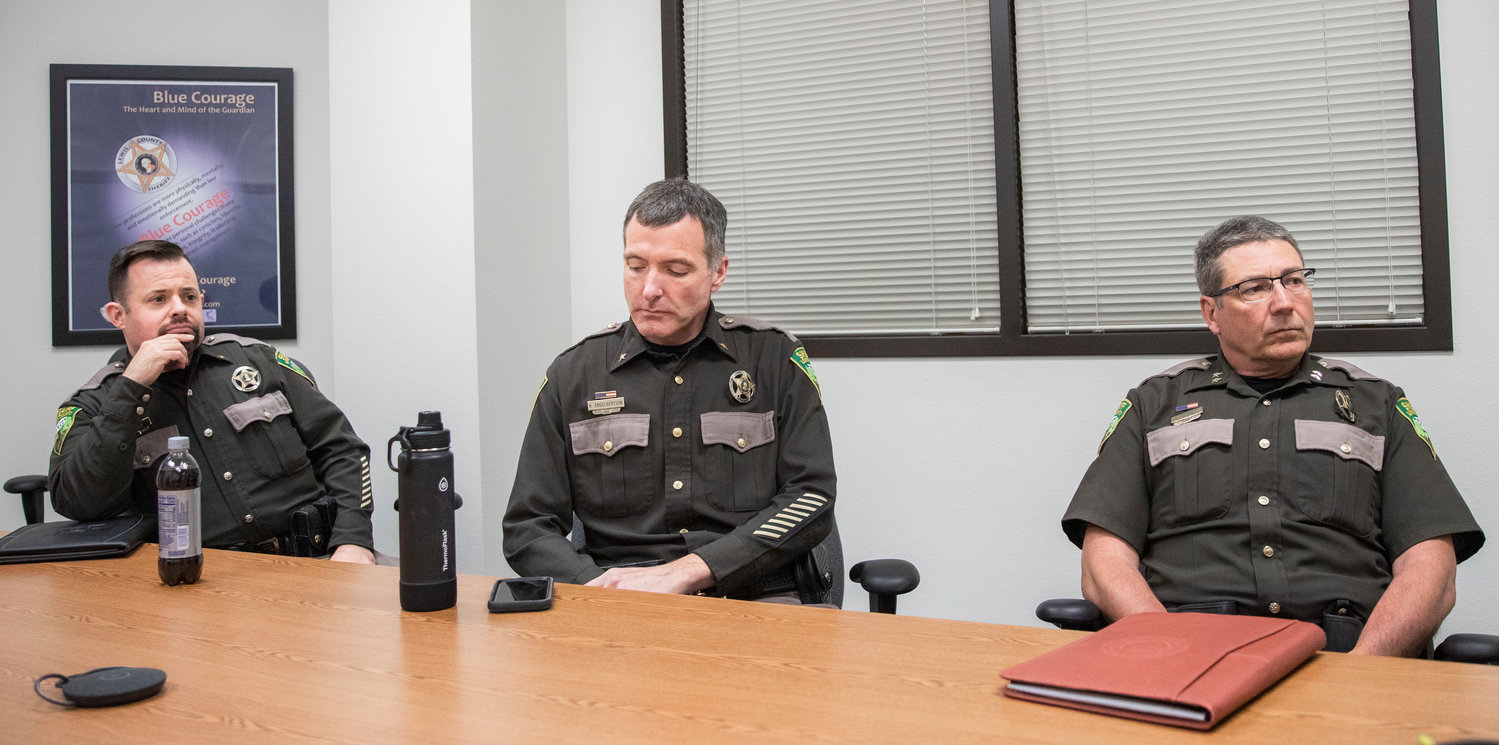 Field Operations Chief Dusty Breen, Special Services Chief Kevin Engelbertson and Undersheriff Wes Rethwill listen on Wednesday at the Lewis County Law and Justice Center as Sheriff Rob Snaza describes his office’s response to the August killing of Portland man Aron Christensen and frustration that followed in the coming months from friends, family and the general public. Charges have not been filed against a man who admitted to shooting Christensen.