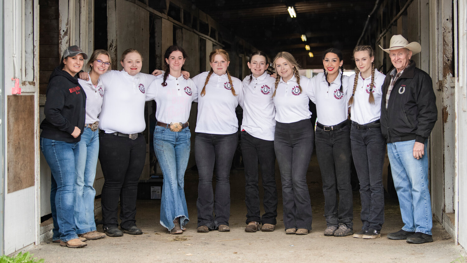 Seniors on the W.F. West equestrian team pose with their coaches for a photo during the final district meet of the season in Tacoma last April. From left, Coach Lea Elder, Savanna Dorning, Liberty Smith, Josey Majors, Reagan Olson, Madison Smith, Allie Sutich, Jeznee Journee, Raylee Andseron and Head Coach Adam Kasper.
