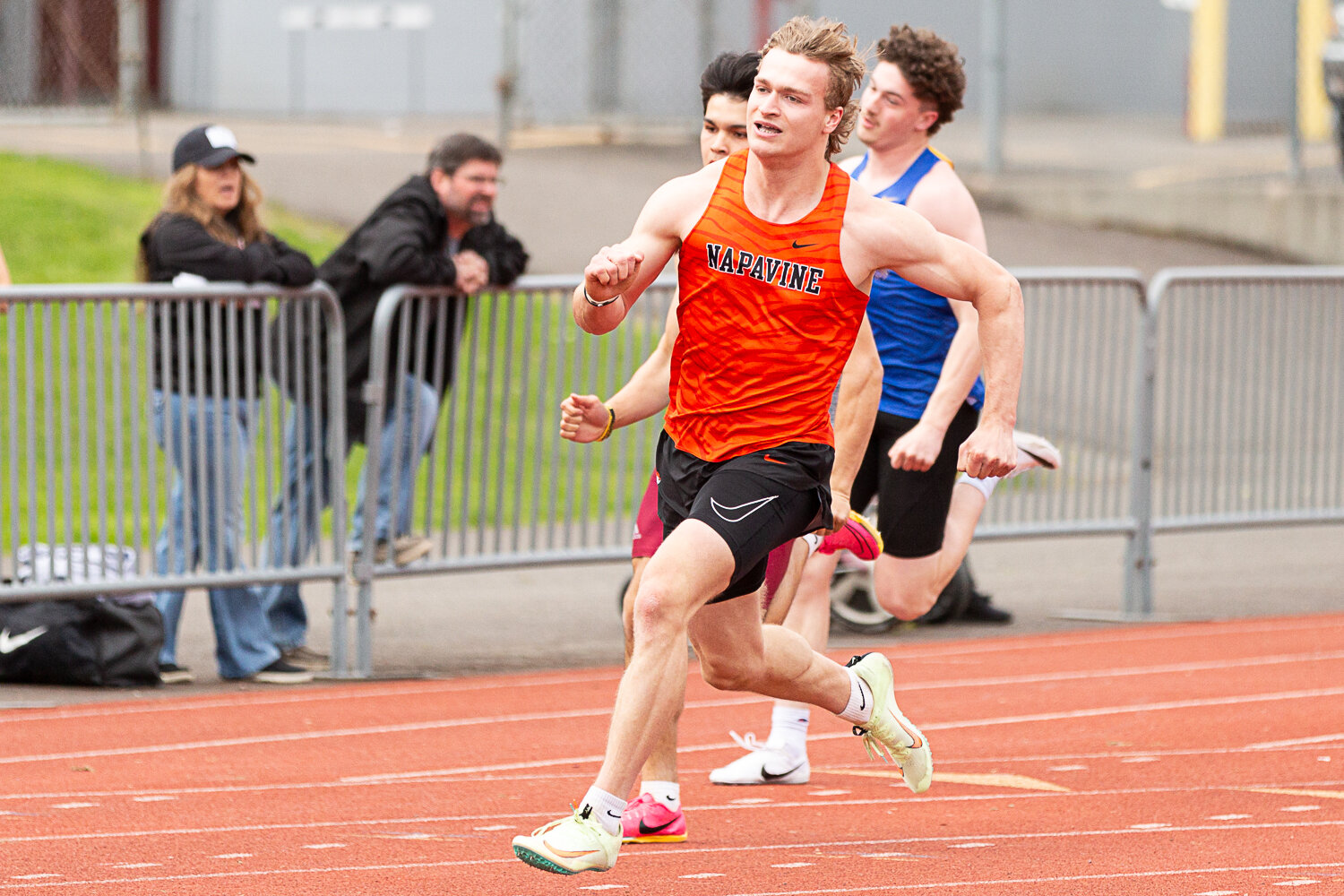 Napavine's Max O'Neill seperates from the pack after the curve in the 200-meter dash at the Chehalis Activators Classic April 22 at W.F. West.
