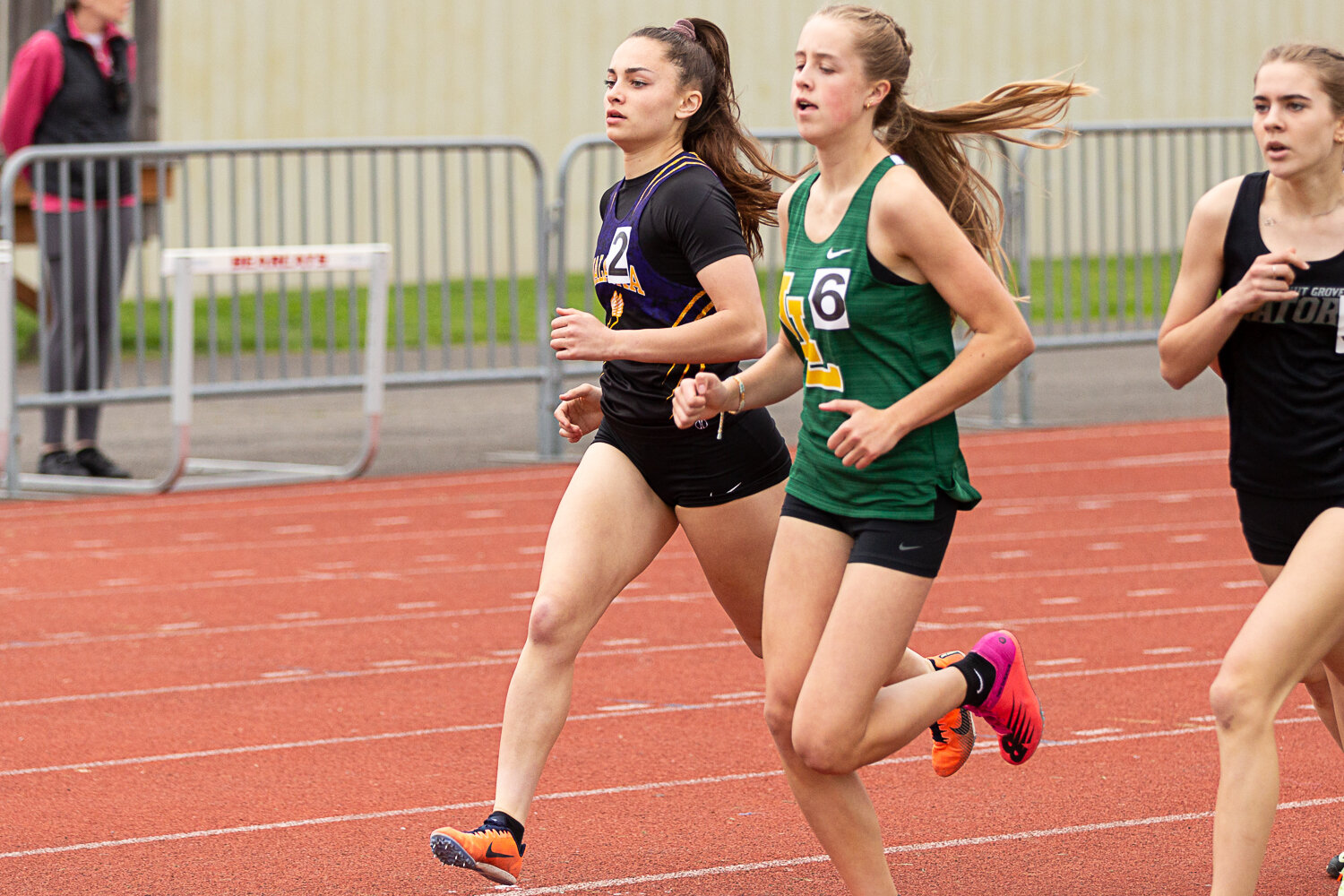 Onalaska's Brooklyn Sandridge looks to get outside of a Lynden runner in the 800 meters at the Chehalis Activators Classic April 22 at W.F. West.