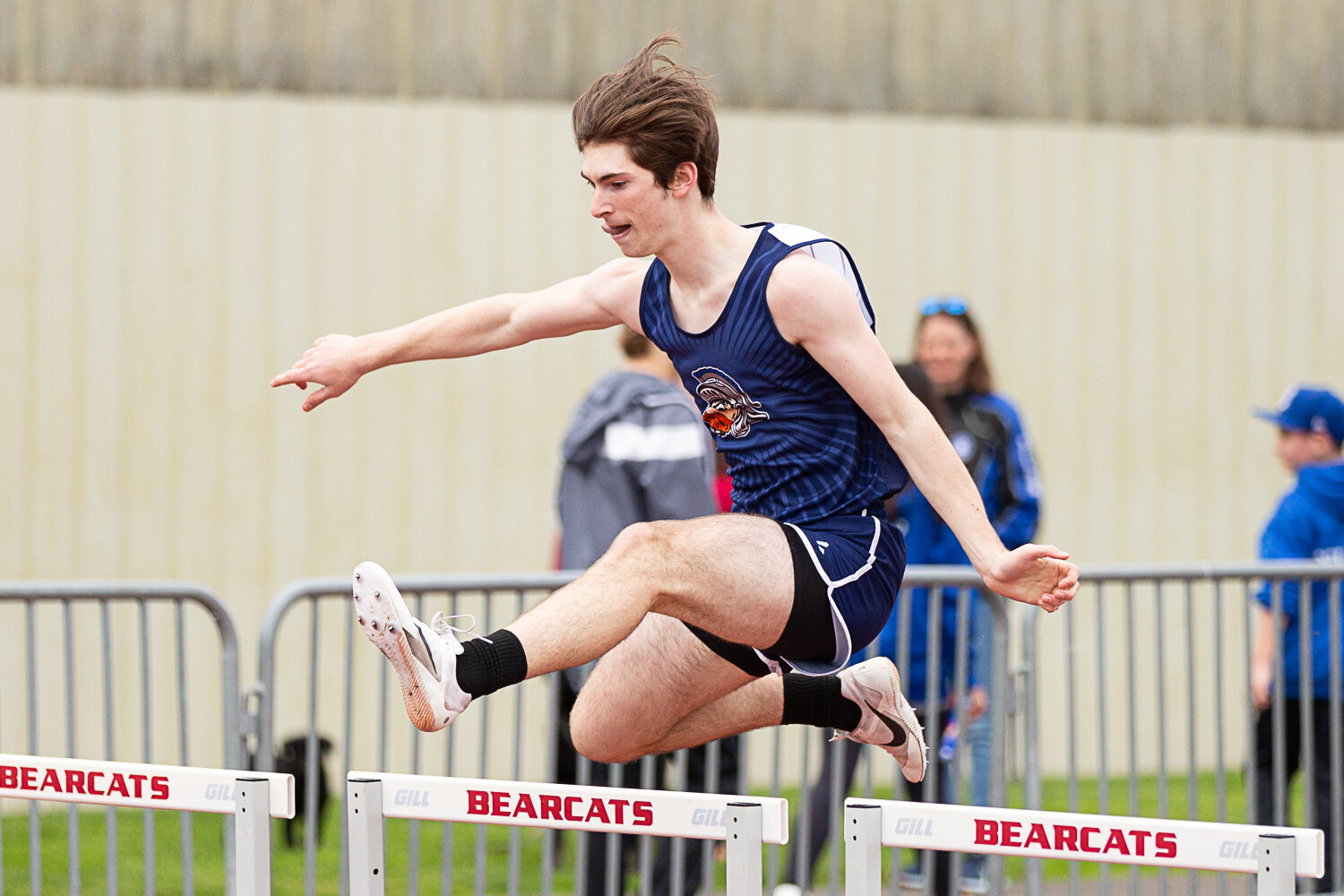Pe Ell's Carter Phelps clears a hurdle in the 300-meter hurdles at the Chehalis Activators Classic April 22 at W.F. West.