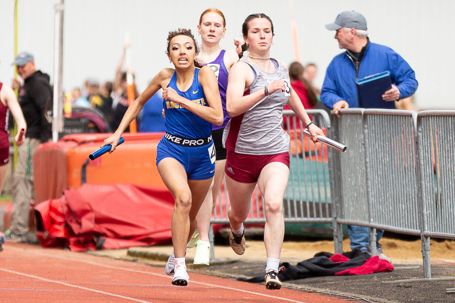 Rochester's Mercedies Dupont (left) and W.F. West's Amanda Bennett (right) fight for a photo finish in the 4x200-meter relay at the Chehalis Activators Classic April 22 at W.F. West.