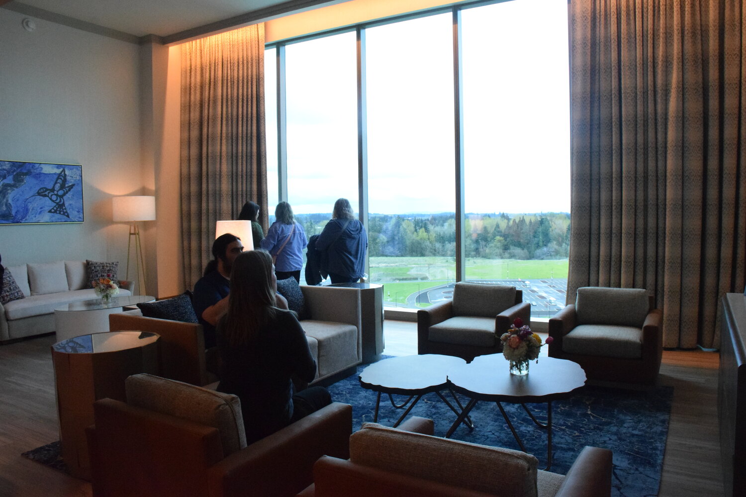 Attendees of a grand opening for ilani’s new hotel take in the sights of one of the nearly 300-room building’s suites following a ribbon cutting for the hotel April 24.