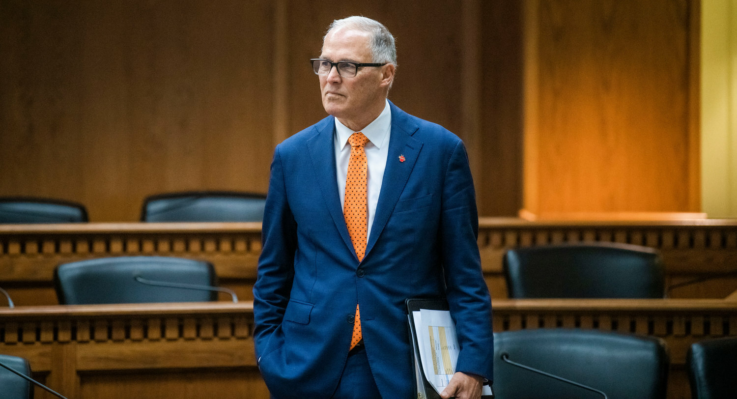 Governor Jay Inslee looks on before taking questions from members of the press inside the John A. Cherberg Building in Olympia earlier this year.