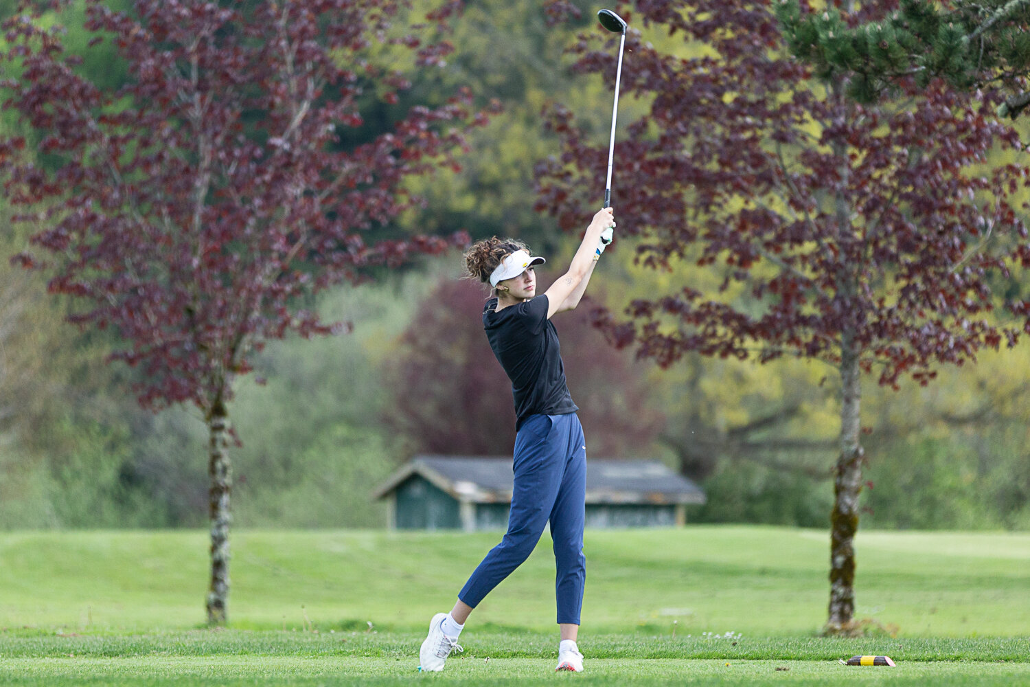 Rochester's Isabella Masias tees off on hole one at Tumwater Valley Golf Course for the 2A EvCo Championships May 9.