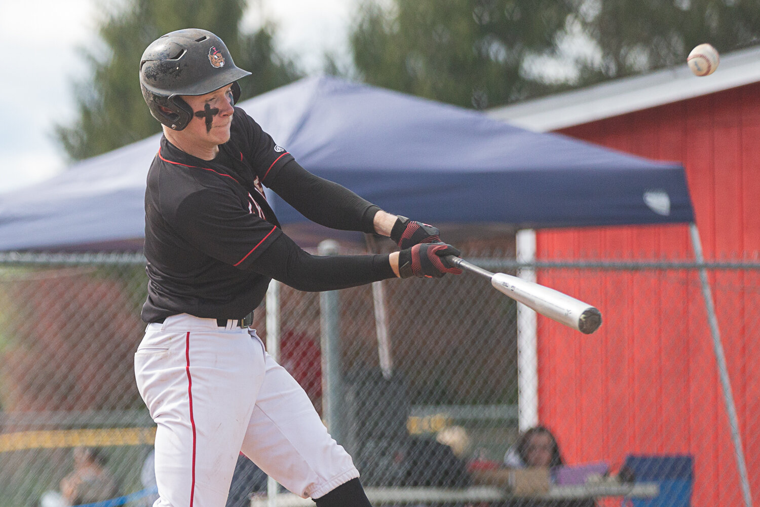Tenino catcher Austin Gonia makes contact with a pitch against La Center in the 1A District 4 semifinals May 9 at Castle Rock.