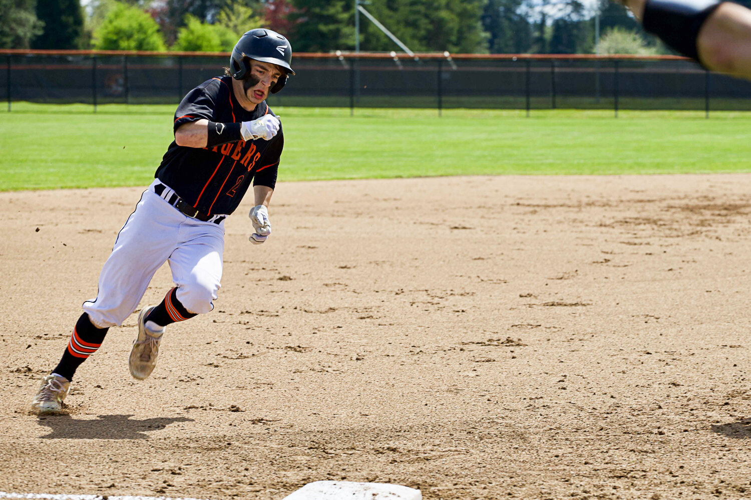 Napavine's Austin Chapman rounds third to score a run against Forks in the 2B District 4 consolation quarterfinals May 9 in Napavine.
