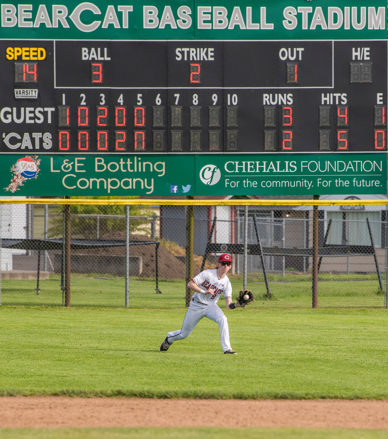 W.F. West’s Avery Staloch (9) stops a ball with his glove in the outfield during a game against Mark Morris at Bearcat Stadium in Chehalis on Tuesday, May 9.