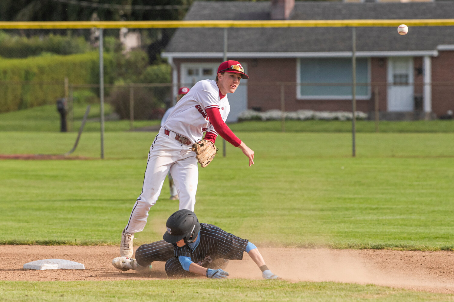 W.F. West’s Weston Potter (4) turns a double-play during a game against Mark Morris at Bearcat Stadium in Chehalis on Tuesday, May 9.