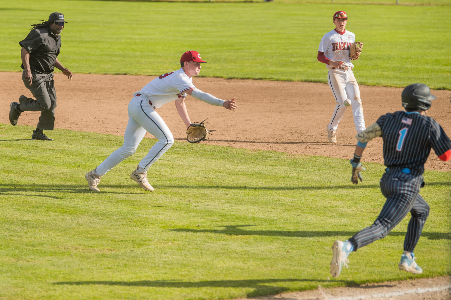 W.F. West’s Gavin Fugate (13) throws a baserunner out during a game against Mark Morris at Bearcat Stadium in Chehalis on Tuesday, May 9.