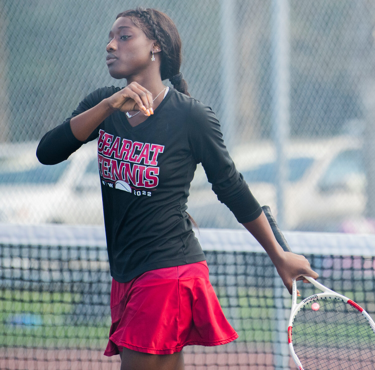 W.F. West first singles player Mariana Ceesay smirks after winning a point during the Evergeen Conference league championship match against Shelton’s Hannah Pratt on the Black Hills courts on Tuesday.