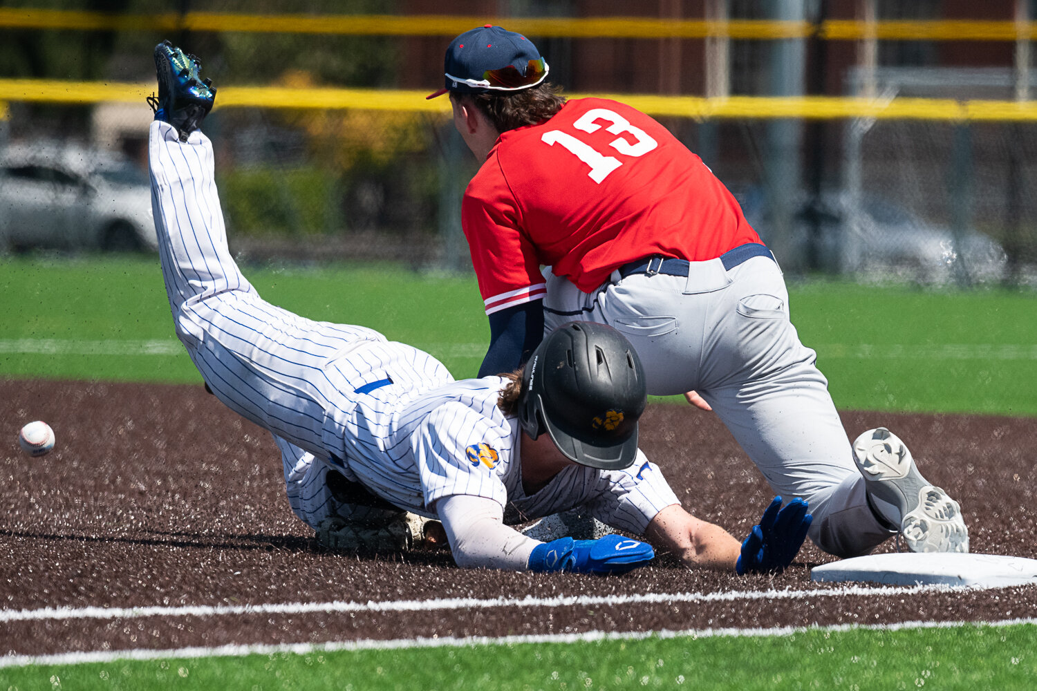 Cameron Duggan dives back to first base after getting a bit too far out on a flyout, during Centralia College's 8-3 loss to Lower Columbia on May 12.