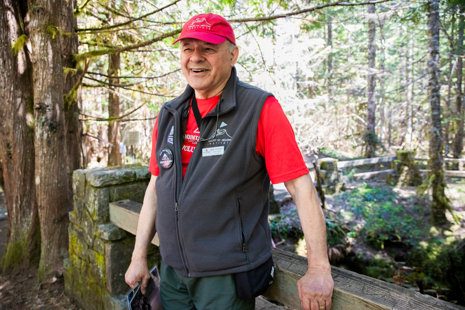 Certified Volcano Naturalist Nick Giovanni smiles while talking about the 1980 eruption of Mount St. Helens at the entrance to the Ape Cave Interpretive Site in Cougar on opening day Thursday, May 18.