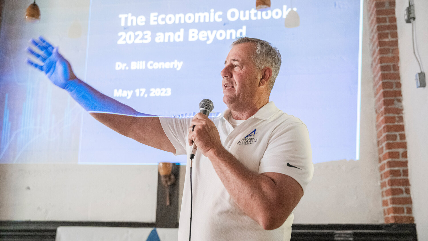 Richard DeBolt, Executive Director for the Economic Alliance of Lewis County, introduces Dr. Bill Conerly and an economic forecast presentation at The Juice Box in Centralia on Wednesday, May 17.