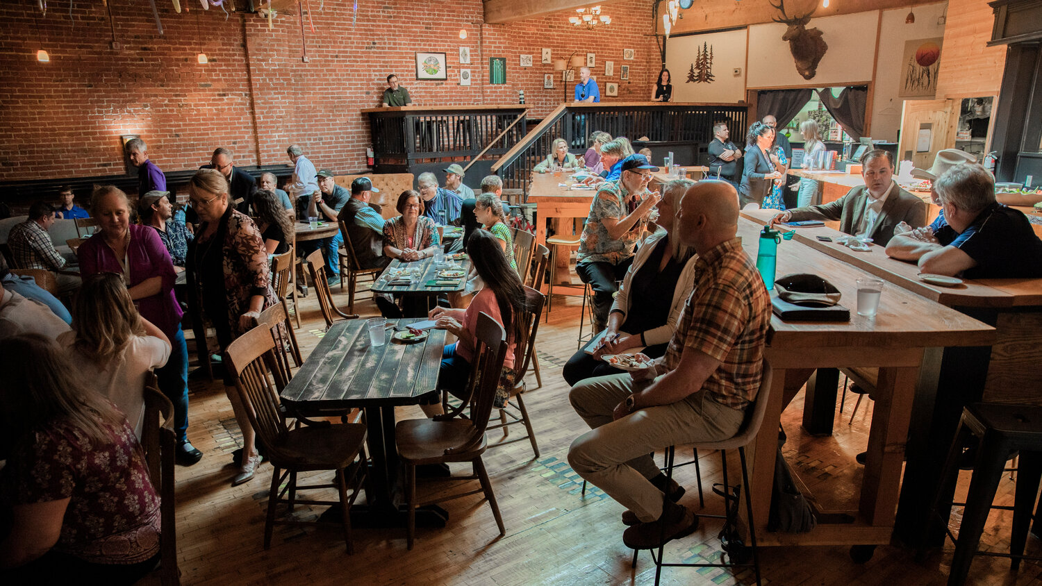 Attendees gather to learn about the economic forecast for Lewis County during an event hosted by the Economic Alliance of Lewis County at The Juice Box in Centralia on Wednesday, May 17.