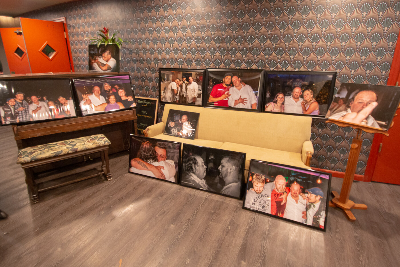 Photos of Justin Ames were on display Saturday night in the foyer of McFiler's Chehalis Theater during a benefit held for his daughters following Ames's death last month.