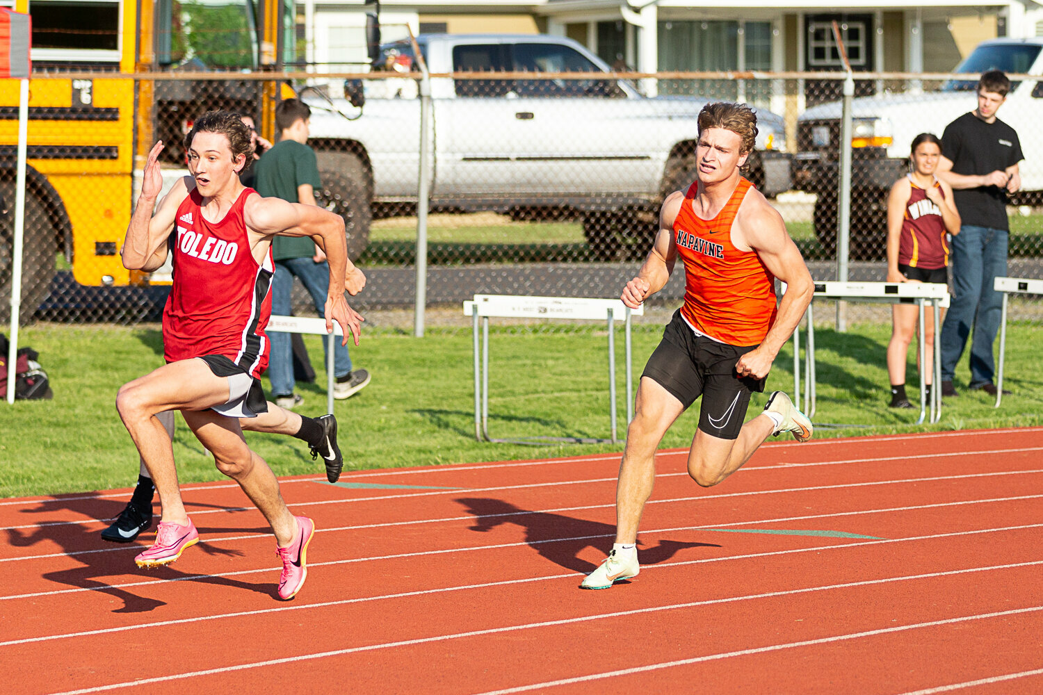 Toledo's Trevin Gale (left) and Napavine's Max O'Neill (right) round the turn in the 200-meter dash May 19 at W.F. West in the 2B District 4 Championships.