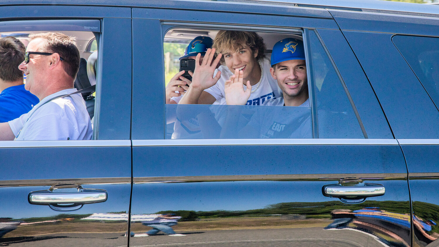 Adna High School baseball players smile and wave to fans and family during a sendoff ceremony before state on Thursday, May 25.